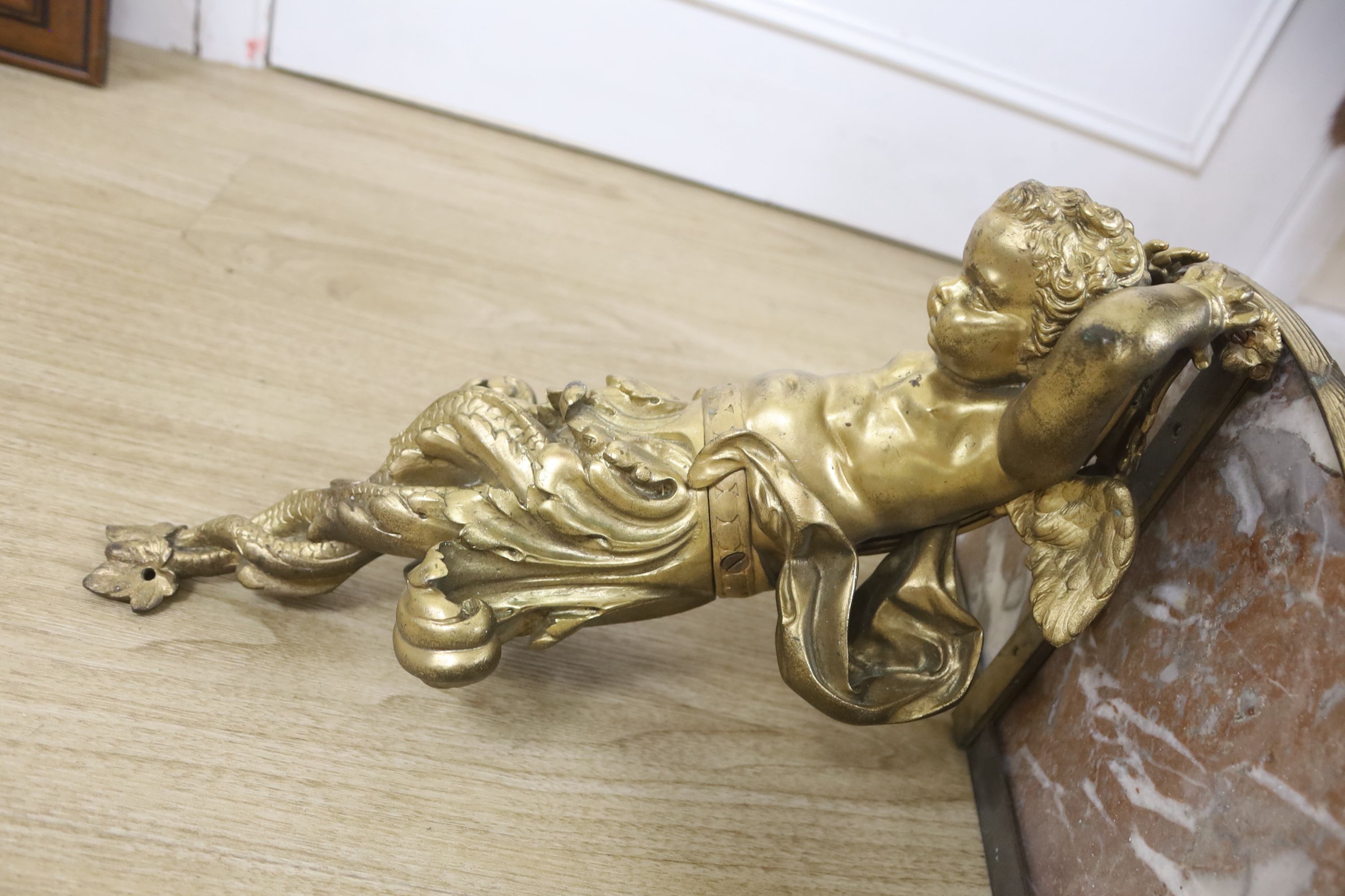 A Louis XV style gilt cast metal marble-topped wall bracket, 52cm wide, 49cm wide